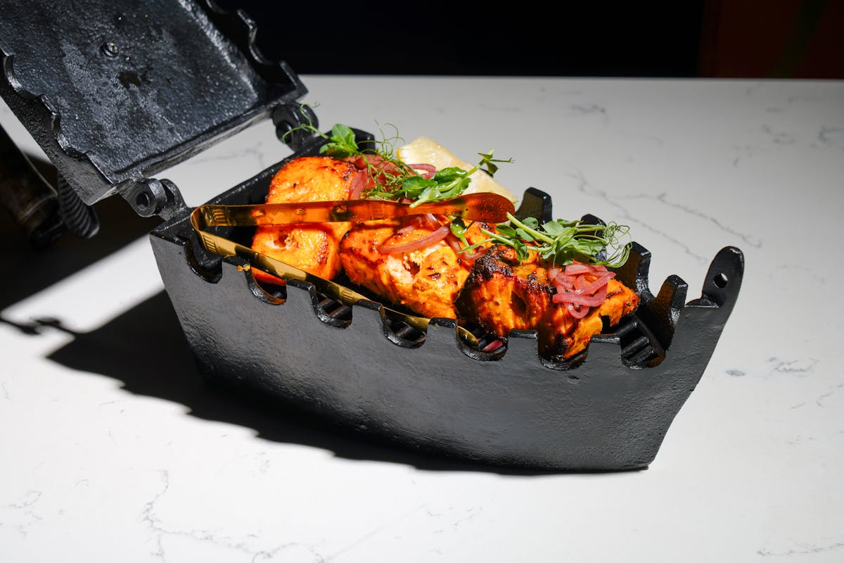 a slice of pizza sitting on top of a cutting board